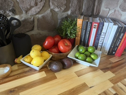 Fruit and vegetables arranged on a kitchen work surface